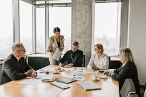 Finance leaders and cost reduction consultants reviewing invoice data, spending reports, and accounts payable controls to identify overpayments and improve profitability.