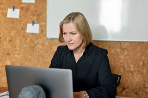 Director of Finance reviewing invoice data and financial records to investigate billing discrepancies, duplicate payments, and hidden costs affecting profitability.