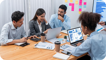 young-creative-people-working-together-with-laptop-group-cool-guys-working-new-project-while-spending-time-modern-office 1