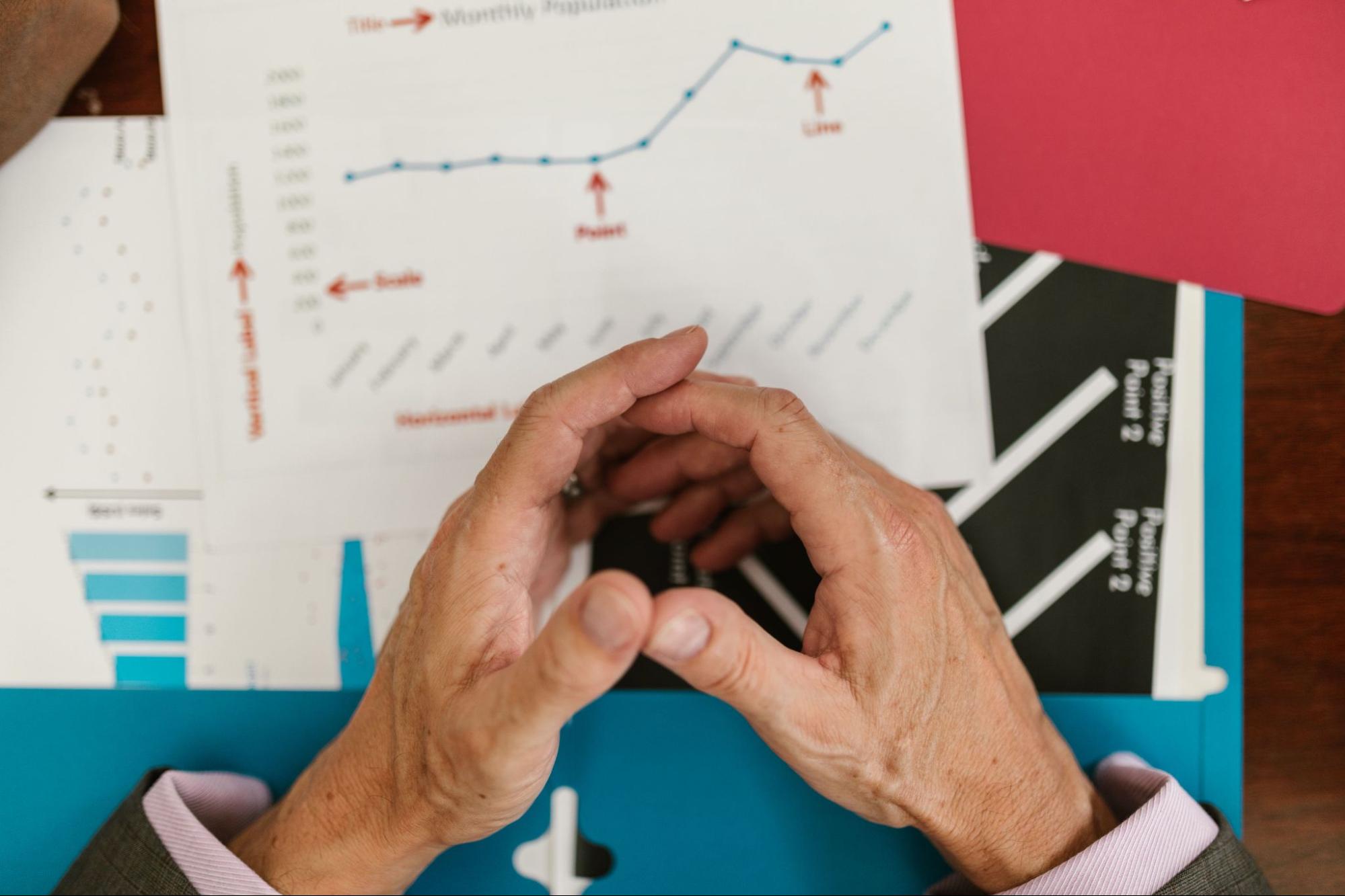 Business executive reviewing financial reports after improving spend management and reducing Sales & Use Tax leakage. 