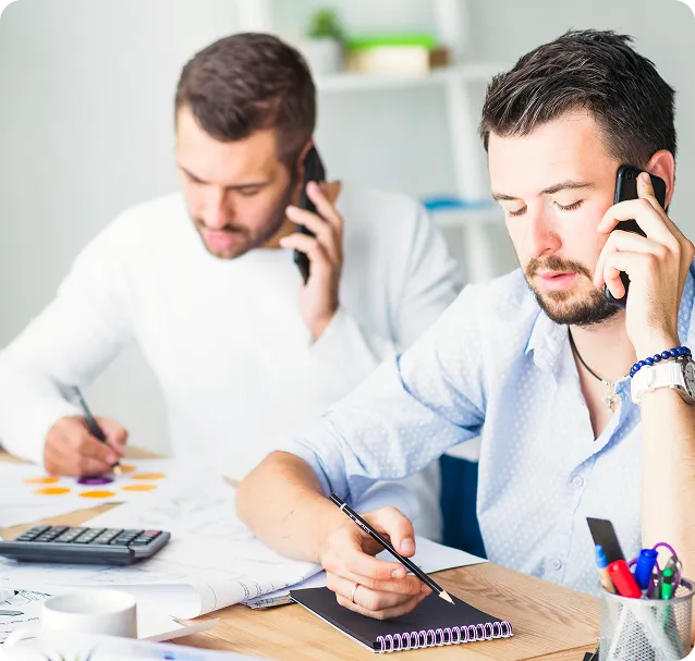two-businessmen-talking-cellphone