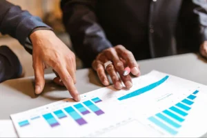 Manufacturing procurement manager comparing vendor pricing and market benchmarks