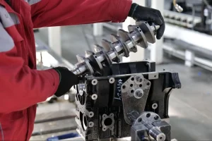 Automotive parts manufacturer reviewing operating expenses and cost data