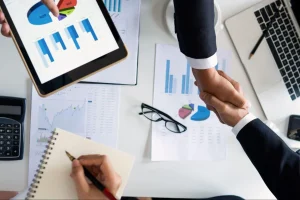 Manufacturing procurement executive reviewing vendor cost savings