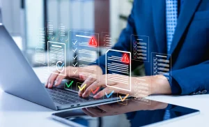 Digital checklists and red warning symbols on a laptop illustrate accounts payable risks, including potential gaps in vendor data verification and payment controls.